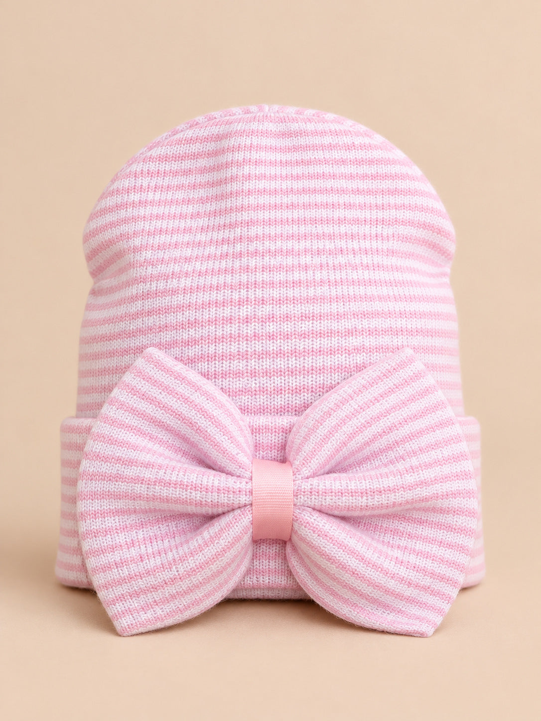 Bonnet bébé naissance en coton rose et blanc, rayures et gros nœud, vue de face
