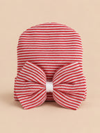 Bonnet bébé naissance en coton rouge et blanc, rayures et gros nœud, vue de face