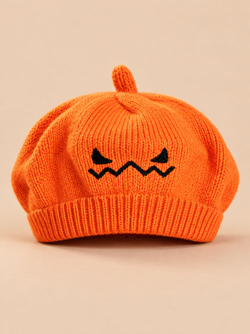 Béret enfant citrouille orange en maille avec visage brodé, vue de face