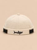 Bonnet docker Bocca blanc en coton, broderie SHARK et boucles réglables, vue de face.