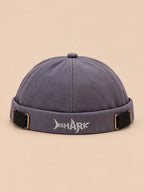Bonnet docker Bocca bleu gris en coton, broderie SHARK et boucles réglables, vue de face.