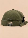 Bonnet docker réversible vert, vue de face.