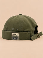 Bonnet docker réversible vert, vue de face.