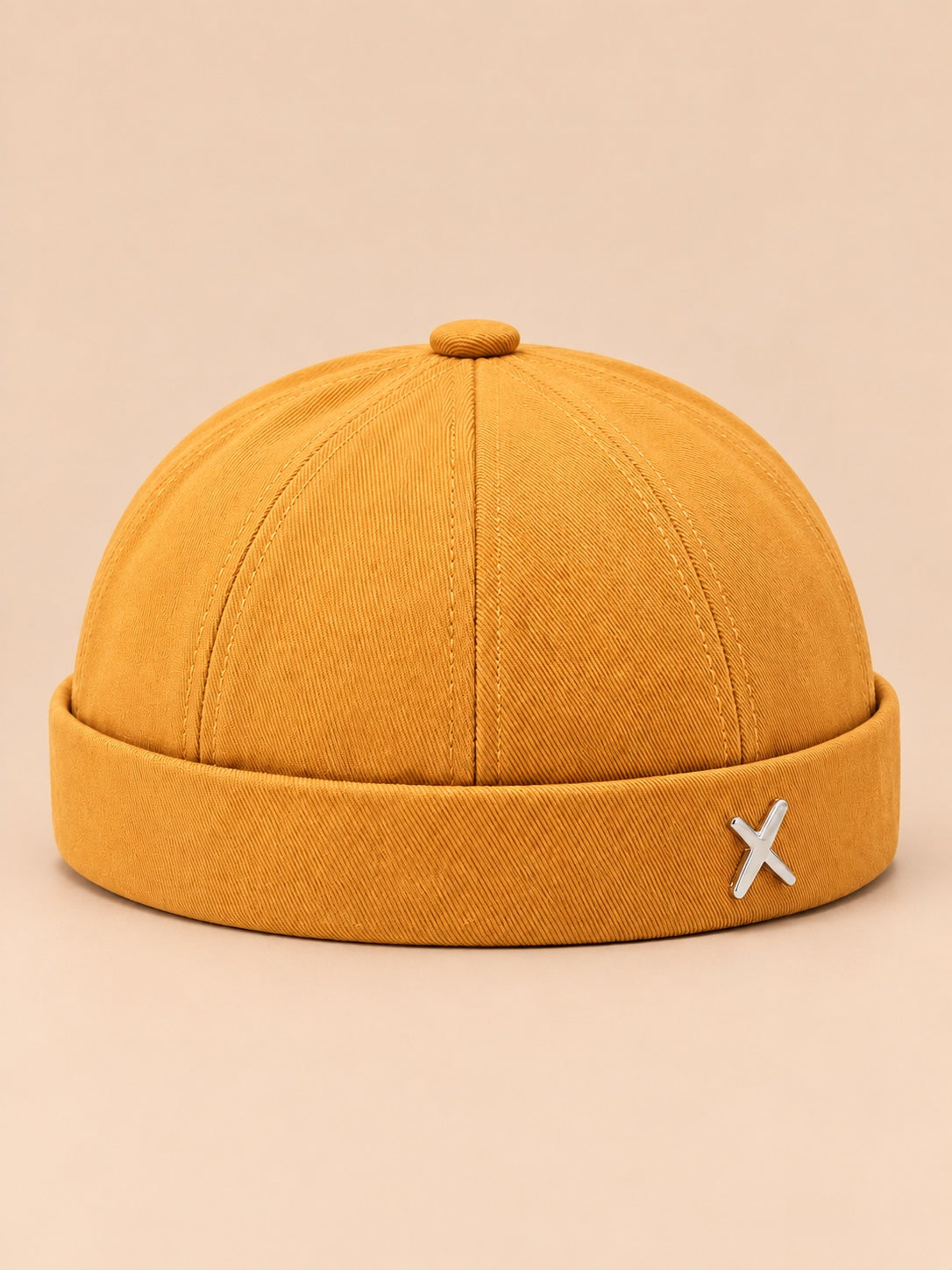 Bonnet docker vintage délavé jaune, vue de face.