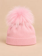 Bonnet enfant rose pompon assorti en maille à revers, vue de face