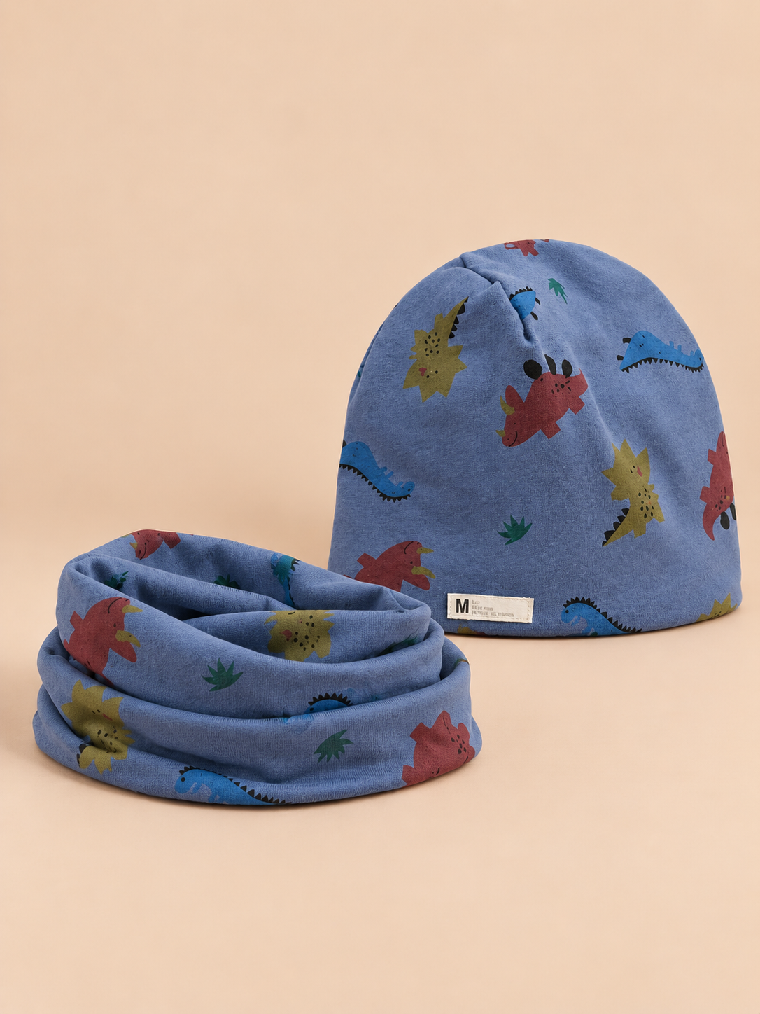 Ensemble bonnet et snood enfant Dinosaure bleu, vue de face.