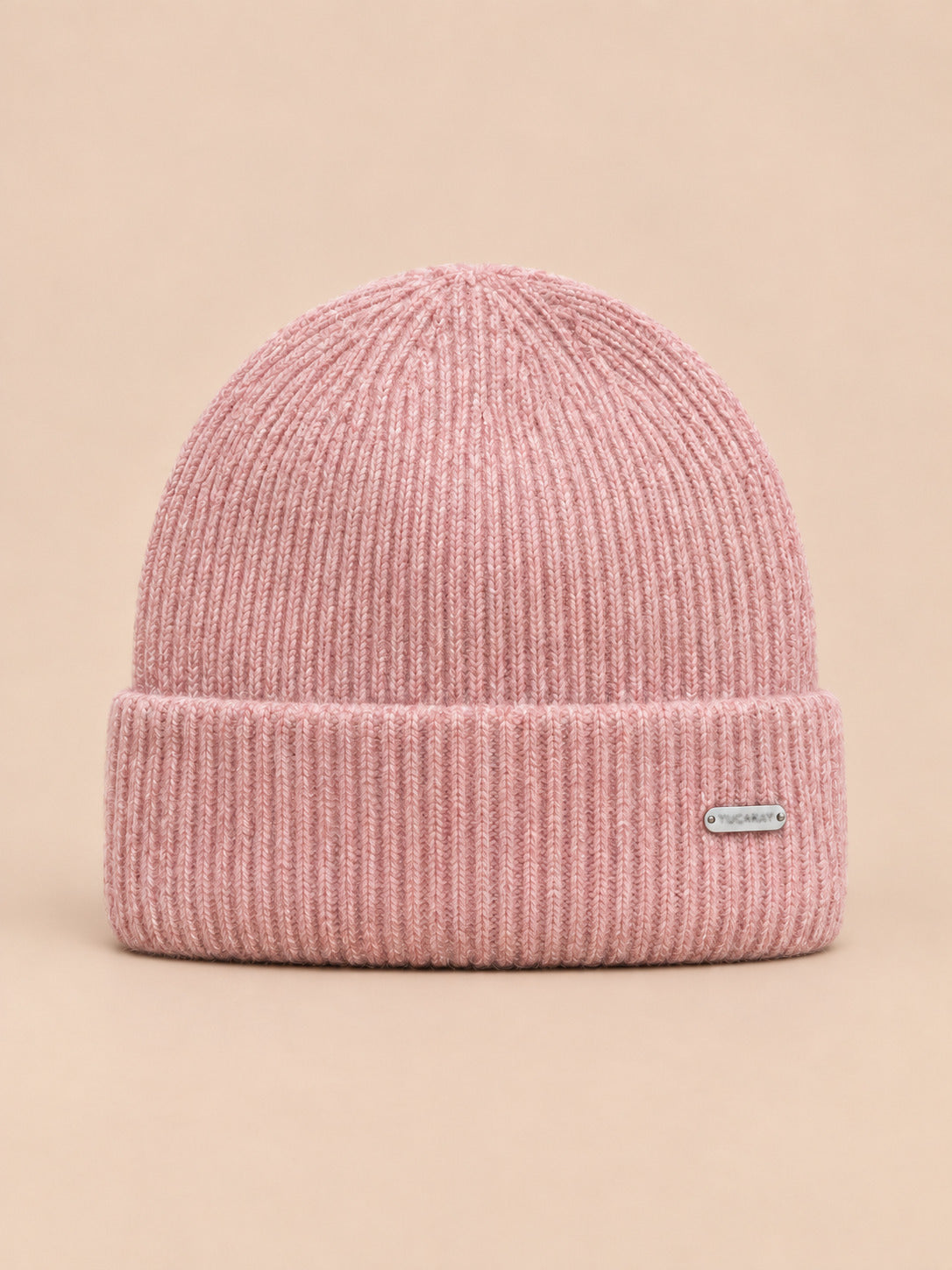 Bonnet côtelé en laine mélangée, coloris 4 rose, vue de face sur fond pêche sable