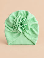 Bonnet turban bébé fille à fleur en tissu, vert, vue de face